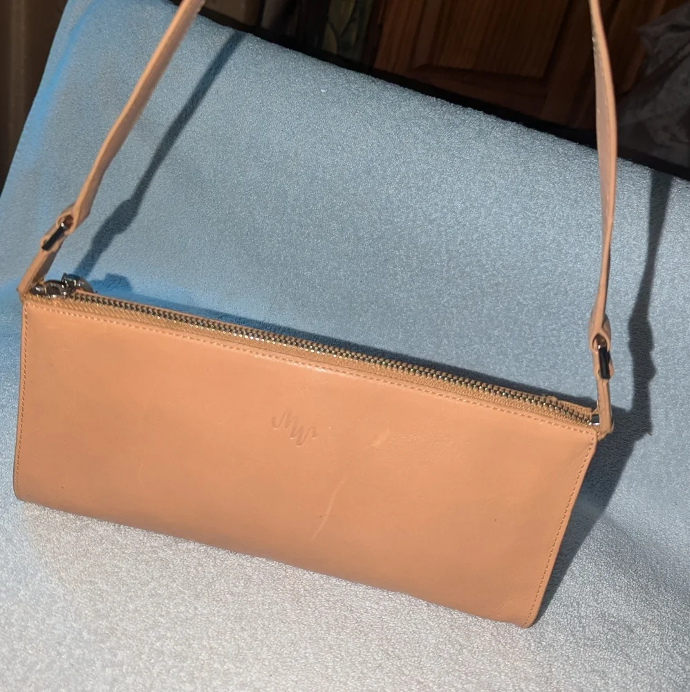 Monsac tan leather bag.